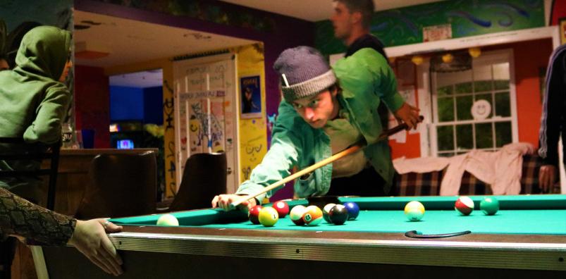 Students playing pool at C-Haus.